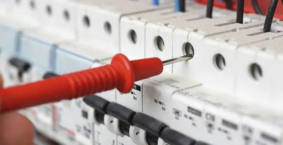 Electrical contractor testing circuit breakers during electrical repair in Haddonfield, NJ