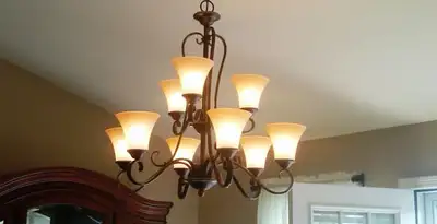 Classic ceiling chandelier installation with warm lighting in Cherry Hill, NJ