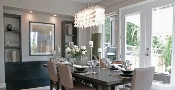 Elegant dining room chandelier installation above table in Cherry Hill, NJ