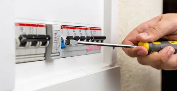 electrical panel upgrade service showing technician adjusting circuit breakers during system upgrade in Cherry Hill, NJ