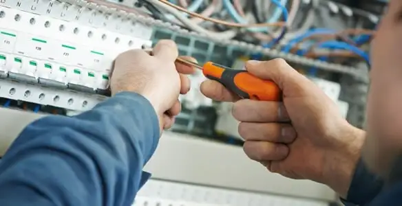 electrical service showing licensed electrician performing electrical panel maintenance and adjustments in Cherry Hill, NJ