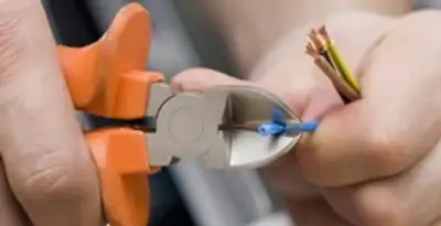 professional electrical services showing precise wire cutting by licensed electricians in Cherry Hill, NJ