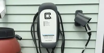 Outdoor electric vehicle charger installation on residential wall in Cherry Hill, NJ