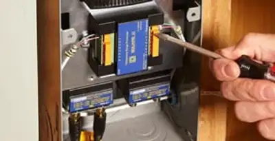 Whole home surge protection device being installed by a licensed electrician to protect electrical systems in Cherry Hill, NJ
